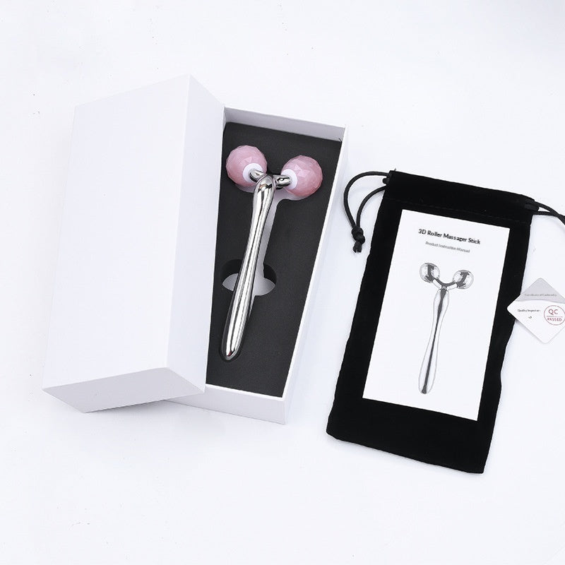 Dewspell Cooling Rose Quartz Facial Roller — rose gold finish