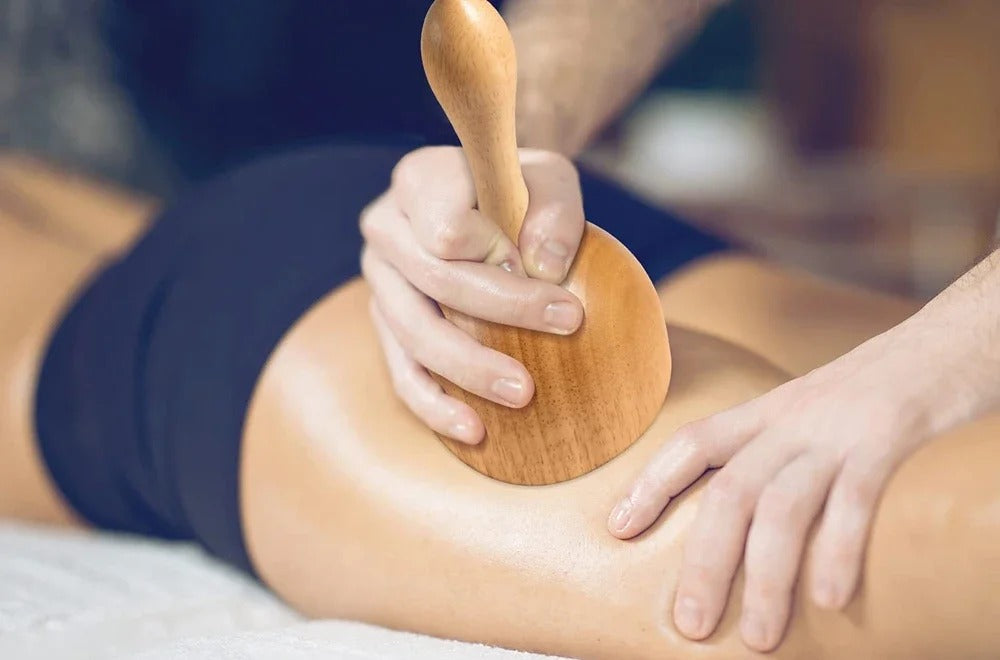Wooden Swedish cup used in a professional-style body massage